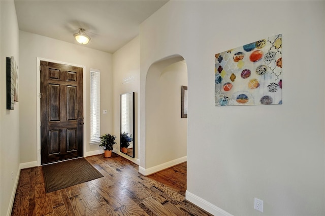 578 Ledge Stone Dr, Austin, TX 78737 - entryway featuring arched walkways and wood finished floors