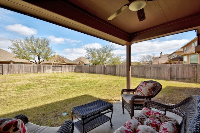 578 Ledge Stone Dr, Austin, TX 78737 - fenced backyard with ceiling fan and a patio
