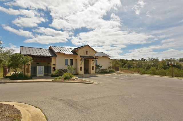 578 Ledge Stone Dr, Austin, TX 78737 - view of front of property with a standing seam roof, uncovered parking, and a metal roof