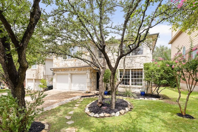 4112 Seldalia Trl, Austin, TX 78732 - view of front of house featuring stone siding, concrete driveway, and a front yard