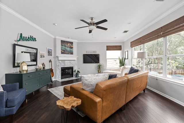 4112 Seldalia Trl, Austin, TX 78732 - living room with a ceiling fan, a premium fireplace, dark wood-style floors, ornamental molding, and recessed lighting