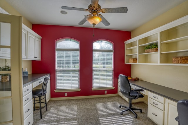 1050 Twisted Oak Dr, Horseshoe Bay, TX 78657 - carpeted office space with built in desk and a ceiling fan