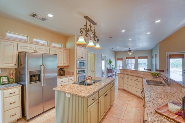 1050 Twisted Oak Dr, Horseshoe Bay, TX 78657 - kitchen with appliances with stainless steel finishes, recessed lighting, an island with sink, light tile patterned floors, and ceiling fan