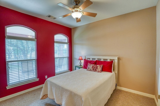 1050 Twisted Oak Dr, Horseshoe Bay, TX 78657 - bedroom with carpet floors and a ceiling fan