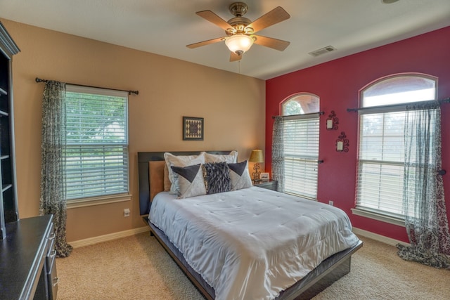 1050 Twisted Oak Dr, Horseshoe Bay, TX 78657 - bedroom with light colored carpet and a ceiling fan
