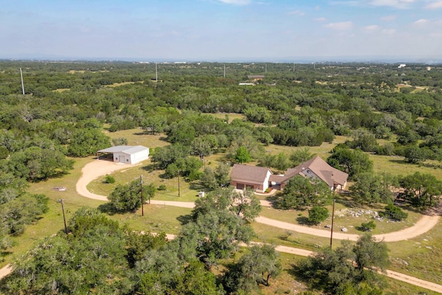 1050 Twisted Oak Dr, Horseshoe Bay, TX 78657 - aerial view of property and surrounding area with a heavily wooded area
