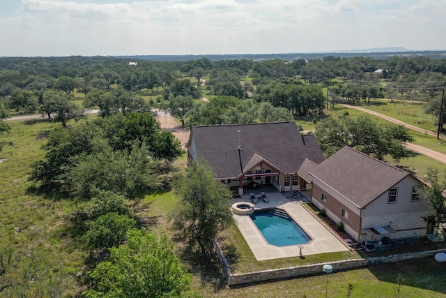 1050 Twisted Oak Dr, Horseshoe Bay, TX 78657 - aerial view of property and surrounding area with a pool area