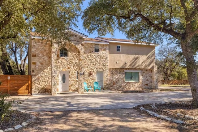 17708 Cherry Ln, Lago Vista, TX 78645 - view of front of home with stone siding and driveway
