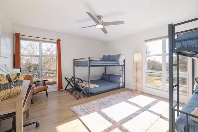 17708 Cherry Ln, Lago Vista, TX 78645 - bedroom featuring wood finished floors and ceiling fan