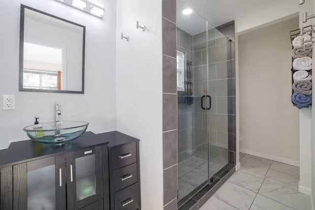 17708 Cherry Ln, Lago Vista, TX 78645 - bathroom featuring marble finish floors, a shower stall, and vanity