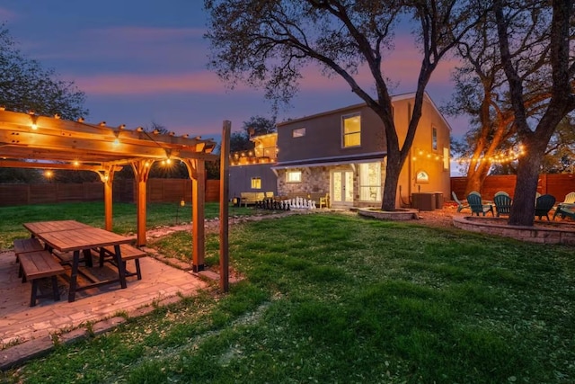 17708 Cherry Ln, Lago Vista, TX 78645 - fenced backyard with a patio, french doors, and outdoor dining space