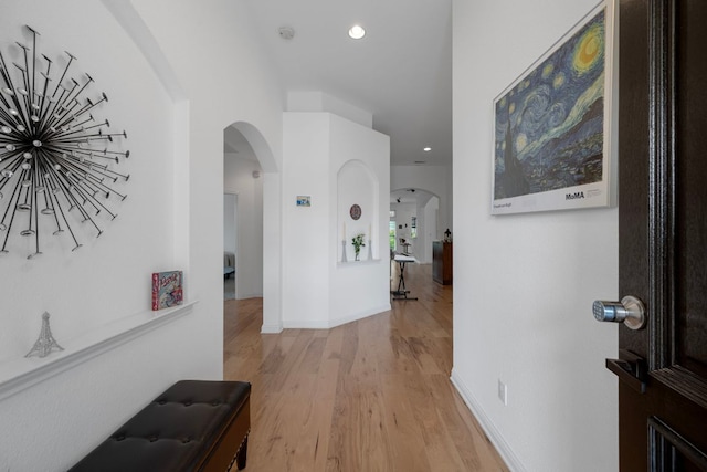 15800 Tetons Ct, Bee Cave, TX 78738 - hallway featuring arched walkways, light wood-type flooring, and recessed lighting