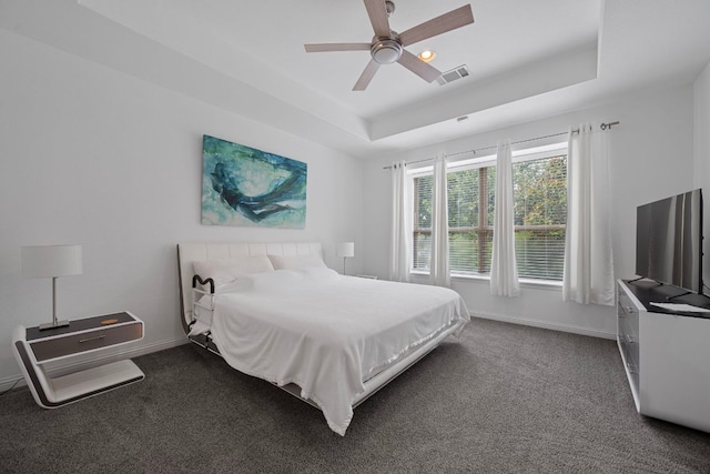 15800 Tetons Ct, Bee Cave, TX 78738 - bedroom featuring a raised ceiling, dark colored carpet, ceiling fan, and recessed lighting
