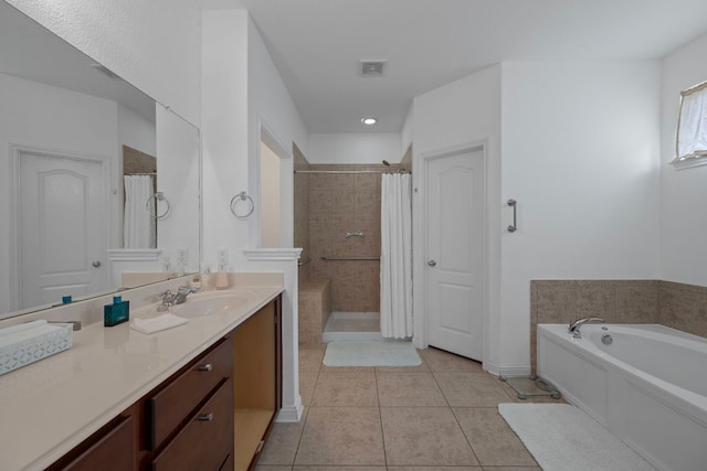 15800 Tetons Ct, Bee Cave, TX 78738 - bathroom with tiled shower, vanity, tile patterned floors, a garden tub, and recessed lighting