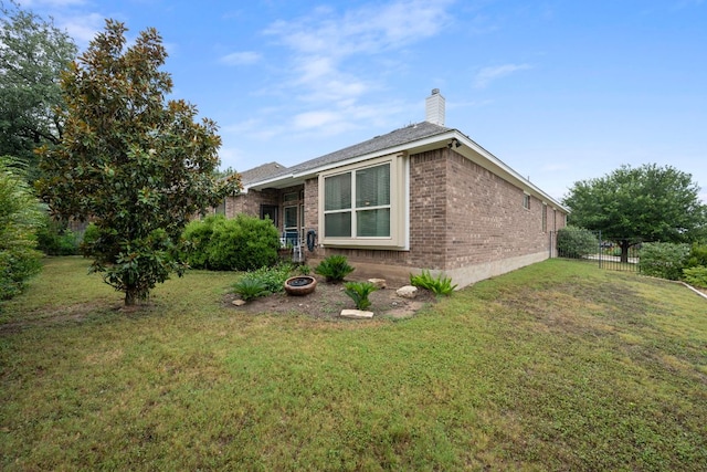15800 Tetons Ct, Bee Cave, TX 78738 - view of property exterior featuring brick siding and a chimney