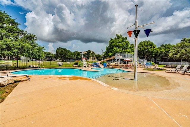 911 Bogart Rd, Cedar Park, TX 78613 - community pool featuring a water slide and a patio area