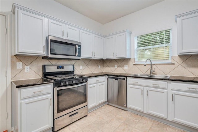 911 Bogart Rd, Cedar Park, TX 78613 - kitchen with stainless steel appliances, white cabinets, and decorative backsplash