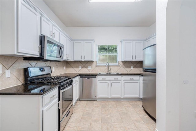 911 Bogart Rd, Cedar Park, TX 78613 - kitchen featuring stainless steel appliances, decorative backsplash, and white cabinets