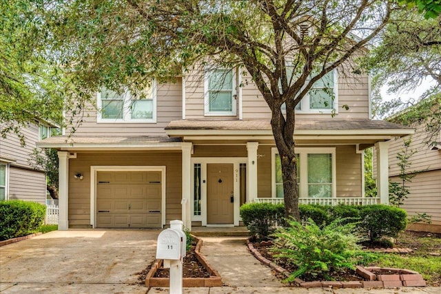 911 Bogart Rd, Cedar Park, TX 78613 - view of front facade with a garage, covered porch, and concrete driveway