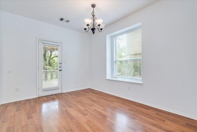 911 Bogart Rd, Cedar Park, TX 78613 - unfurnished room featuring a chandelier and light wood-style floors