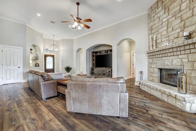 30613 Chi Chi Dr, Georgetown, TX 78628 - living area featuring a ceiling fan, dark wood-style flooring, a fireplace, crown molding, and recessed lighting
