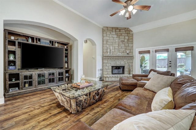 30613 Chi Chi Dr, Georgetown, TX 78628 - living area with a ceiling fan, crown molding, wood finished floors, french doors, and arched walkways