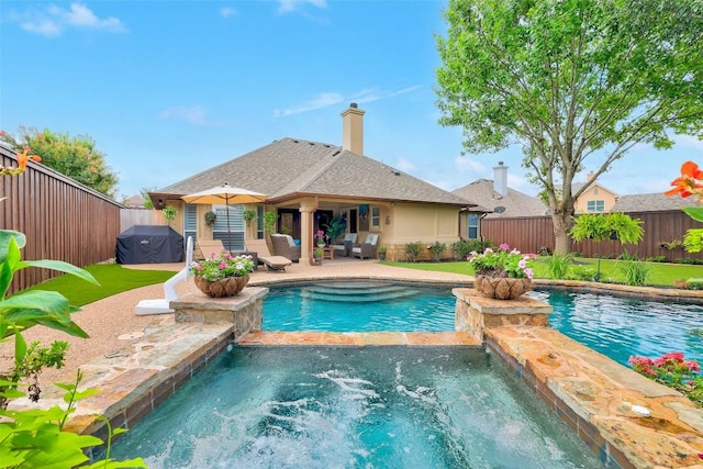 30613 Chi Chi Dr, Georgetown, TX 78628 - view of swimming pool featuring a patio, a fenced backyard, and a pool with connected hot tub