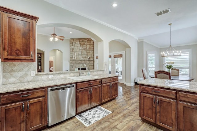 30613 Chi Chi Dr, Georgetown, TX 78628 - kitchen with dishwasher, tasteful backsplash, a ceiling fan, light wood-style flooring, and a chandelier