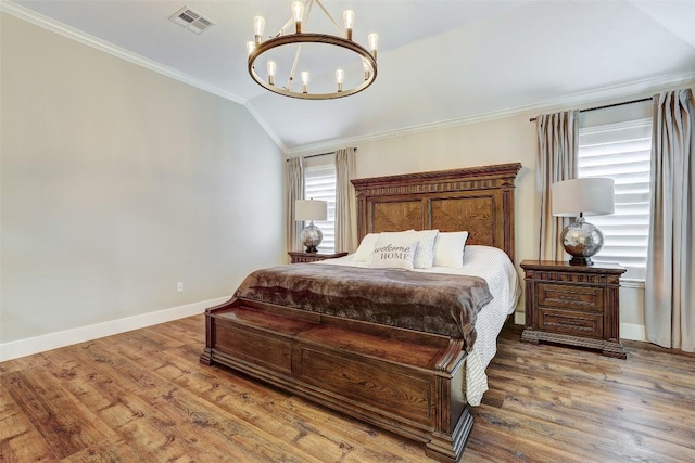 30613 Chi Chi Dr, Georgetown, TX 78628 - bedroom featuring a chandelier, crown molding, vaulted ceiling, and wood finished floors