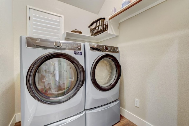 30613 Chi Chi Dr, Georgetown, TX 78628 - laundry room featuring washer and clothes dryer and wood finished floors