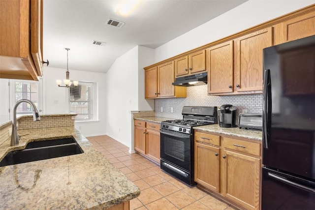 3710 Castle Rock Dr, Round Rock, TX 78681 - kitchen featuring black appliances, under cabinet range hood, vaulted ceiling, backsplash, and light tile patterned flooring