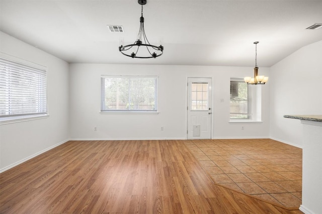 3710 Castle Rock Dr, Round Rock, TX 78681 - unfurnished dining area featuring a chandelier and light wood-style flooring