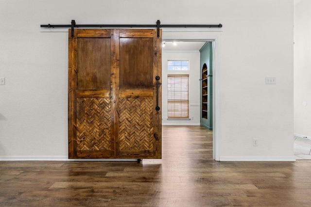 1409 Castle Ridge Dr, Harker Heights, TX 76548 - interior space featuring wood finished floors, a barn door, and ornamental molding