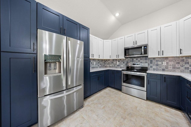 1409 Castle Ridge Dr, Harker Heights, TX 76548 - kitchen featuring appliances with stainless steel finishes, lofted ceiling, light countertops, backsplash, and blue cabinets