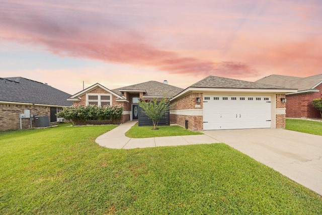 1409 Castle Ridge Dr, Harker Heights, TX 76548 - view of front of home featuring brick siding, driveway, a front lawn, and a garage