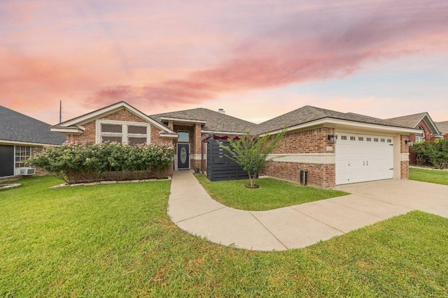 1409 Castle Ridge Dr, Harker Heights, TX 76548 - view of front of home featuring brick siding, concrete driveway, an attached garage, and a front lawn