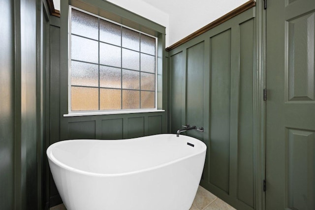 1409 Castle Ridge Dr, Harker Heights, TX 76548 - full bathroom featuring a decorative wall, a freestanding tub, and healthy amount of natural light