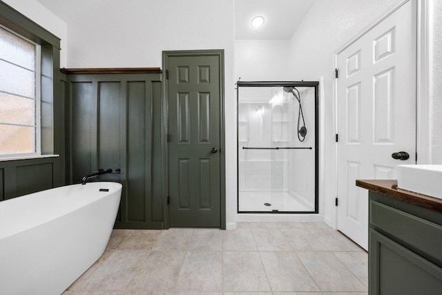 1409 Castle Ridge Dr, Harker Heights, TX 76548 - bathroom featuring a stall shower, a freestanding bath, vanity, and tile patterned flooring