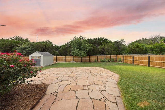 1409 Castle Ridge Dr, Harker Heights, TX 76548 - fenced backyard with a patio area, a shed, and view of scattered trees