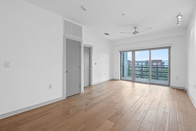 3600 S Lamar Blvd Unit 501, Austin, TX 78704 - spare room featuring light wood finished floors and ceiling fan