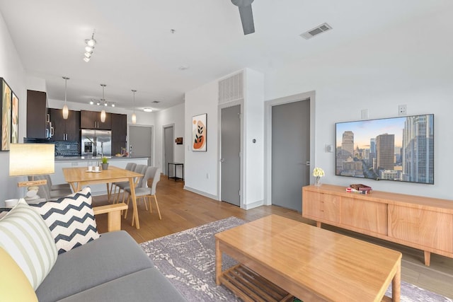 3600 S Lamar Blvd Unit 501, Austin, TX 78704 - living area with ceiling fan, light wood-type flooring, and rail lighting