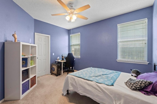 16907 Cranston Dr, Round Rock, TX 78664 - bedroom featuring carpet floors, ceiling fan, and a textured ceiling