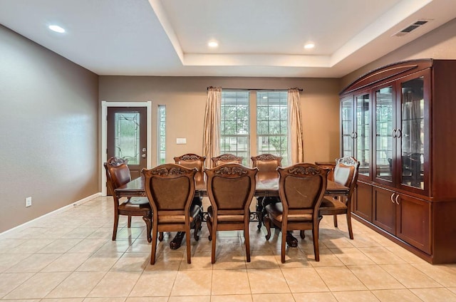 195 Heritage Oaks Dr, Cedar Creek, TX 78612 - dining area with light tile patterned floors, recessed lighting, and a raised ceiling