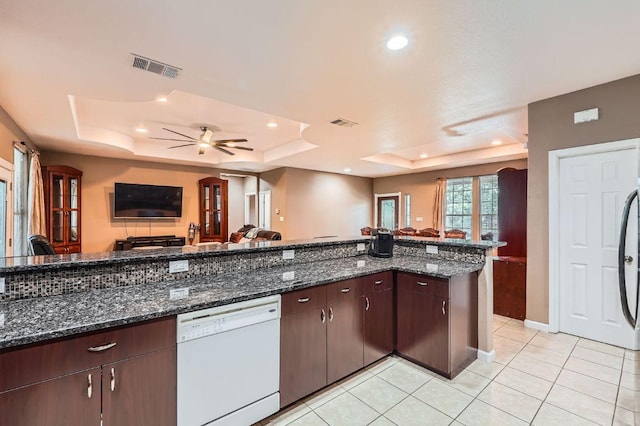 195 Heritage Oaks Dr, Cedar Creek, TX 78612 - kitchen featuring white dishwasher, a tray ceiling, open floor plan, a ceiling fan, and recessed lighting