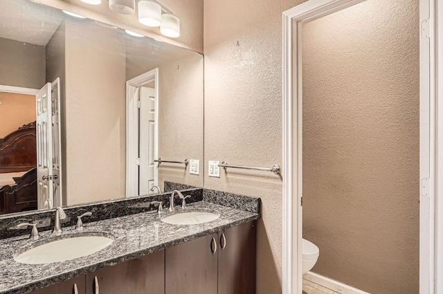 195 Heritage Oaks Dr, Cedar Creek, TX 78612 - full bathroom featuring double vanity and a textured wall