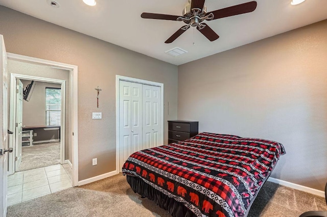 195 Heritage Oaks Dr, Cedar Creek, TX 78612 - carpeted bedroom featuring a closet, ceiling fan, and tile patterned flooring