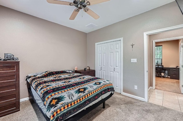 195 Heritage Oaks Dr, Cedar Creek, TX 78612 - tiled bedroom with carpet flooring, a desk, a closet, and ceiling fan