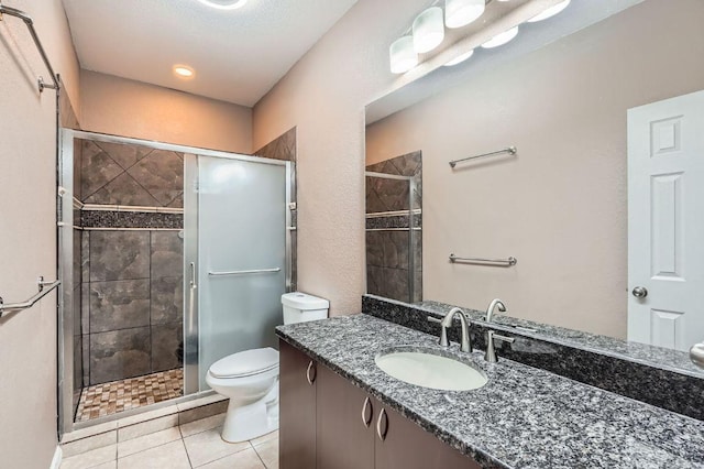 195 Heritage Oaks Dr, Cedar Creek, TX 78612 - bathroom featuring vanity, a shower stall, and tile patterned flooring