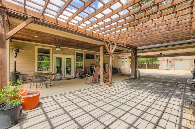 195 Heritage Oaks Dr, Cedar Creek, TX 78612 - view of patio / terrace with ceiling fan, french doors, outdoor dining space, and a pergola