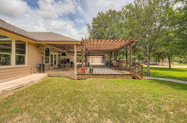 195 Heritage Oaks Dr, Cedar Creek, TX 78612 - view of grassy yard with a pergola, ceiling fan, a deck, and a patio area